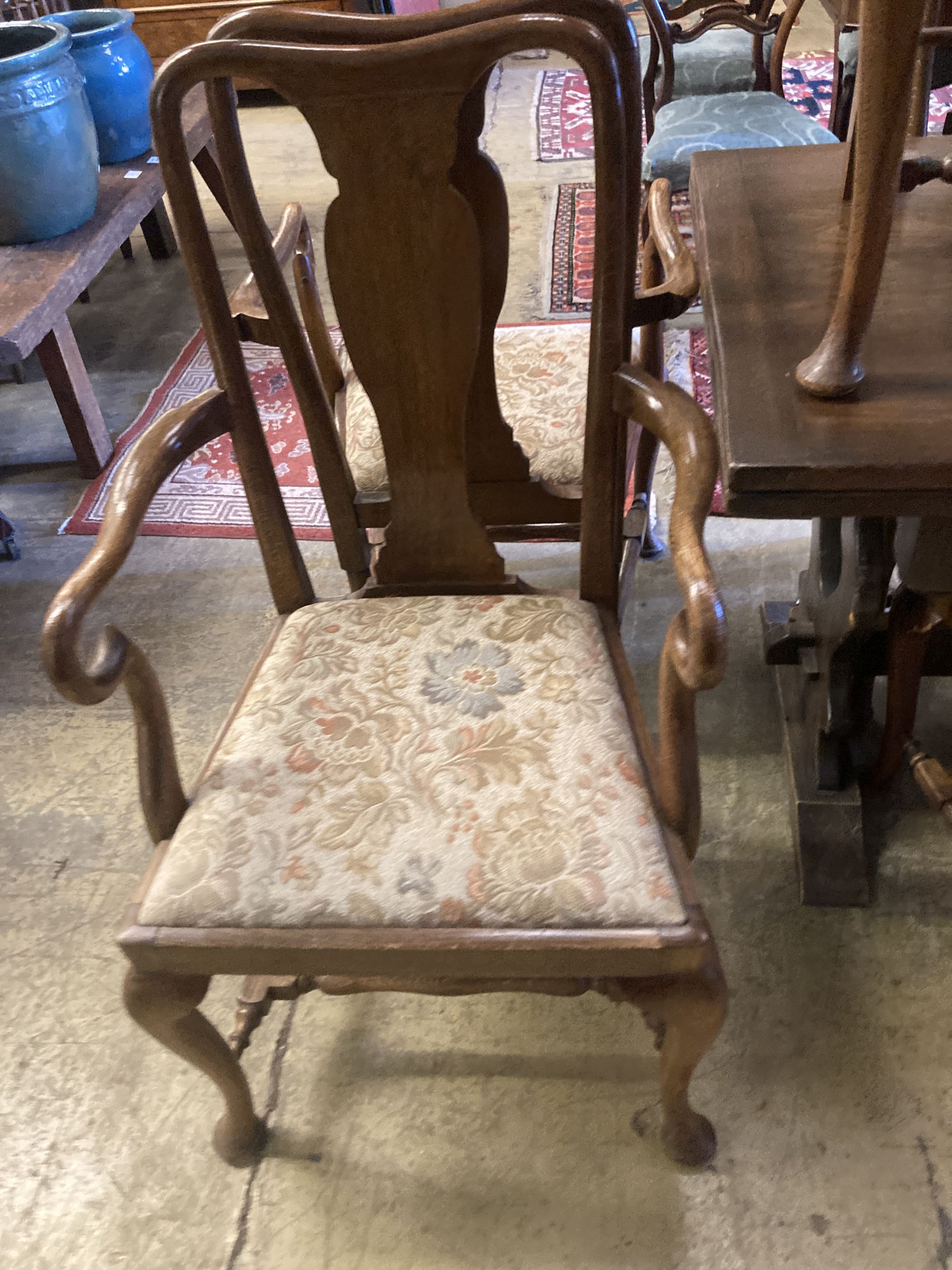 A set of eight 1920s oak Queen Anne-style dining chairs, two with arms